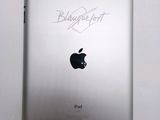 an apple ipad with a signed signature on the back of it