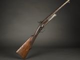 a rifle with a wooden handle on a black background