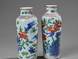 pair of chinese vases with flowers and birds painted on them
