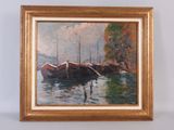 a painting of boats on the water in a gold frame