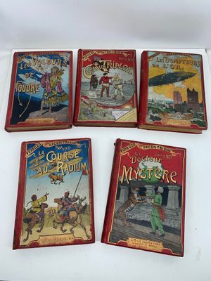 four children ' s books are lined up on a white surface