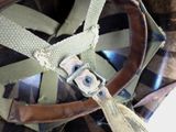 an image of a close up of a helmet with a strap