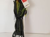 the back view of a pair of black and green skis on a white surface