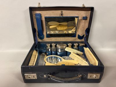 a suitcase that has a bunch of hair brushes in it