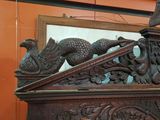 a picture of a clock with a bird on top of it