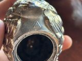 a person holding a metal object in their hand