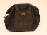 an image of a black bag with a brown handle