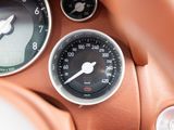 a close up of a car dashboard with a speedometer and gauges