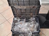 many empty plastic bottles in baskets on the floor