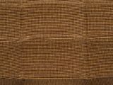 a brown couch that is sitting in the corner of a room