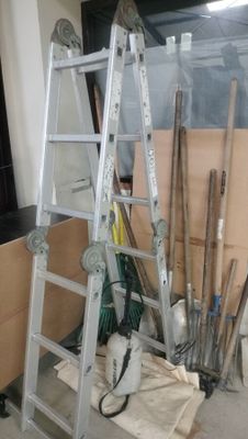 a ladder that is leaning against a wall in a room