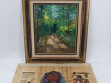 une image représentant une photo d'un tableau posé sur une table à côté d'une œuvre d'art