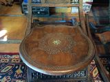 a chair that is sitting on a rug in a room