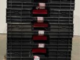 a large stack of plastic containers sitting on a pallet