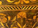 a close up of a wooden table with a bird on it
