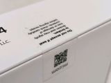the back of a white box with a qr code on it