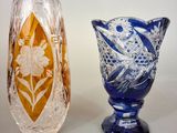 two vases sitting next to each other on a table