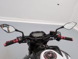 a close up of a motorcycle with a mirror on it ' s handlebars