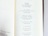someone is holding a book open to a page with a list on it