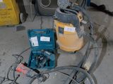a machine that is sitting on the ground next to a box