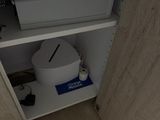 a small cabinet with a printer on top of it