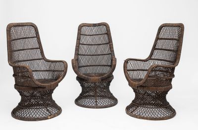 three wicker chairs with a metal frame and metal legs
