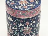a blue and pink box with a floral design on it