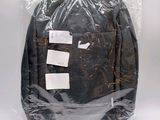 a bag of luggage that is wrapped in plastic