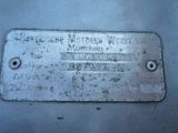a metal plate that has a name on it