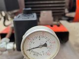 a close up of a pressure gauge on top of a table
