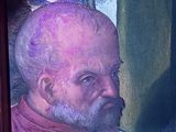 a painting of a man holding a baby in front of a window