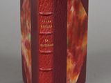 a red book that is open on a table