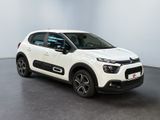a white citrole is parked in a white room