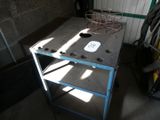 a small table with a wire basket on it