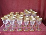 a lot of wine glasses sitting on a table
