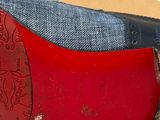 pair of red and blue shoes with a box in the background