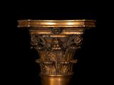 an image of a close up of a gold pedestal on a black background
