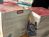 three boxes are stacked on top of each other on a table