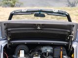 an open trunk of a car with the hood up