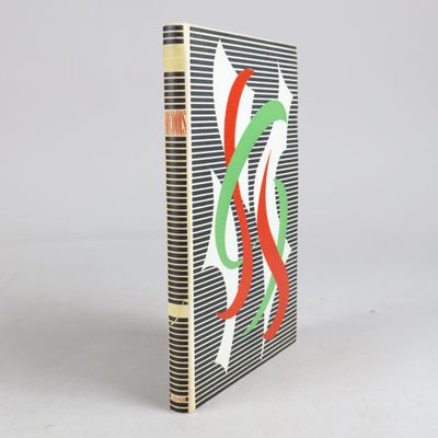 a book with a red, green, and white design on it