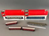 three model trains are sitting next to each other on a table