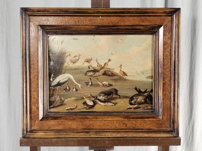une photo d'un tableau représentant des oiseaux, posé sur un chevalet