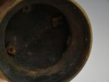a close up of a person holding a metal object