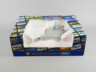 une image représentant une boîte contenant une maquette d'avion