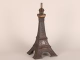 La tour Eiffel est faite de métal et repose sur une base métallique.