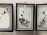 three framed pictures of birds and flowers hanging on the wall