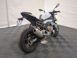 a motorcycle that is parked on the floor in a room