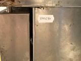 an image of a dirty refrigerator in a dirty kitchen