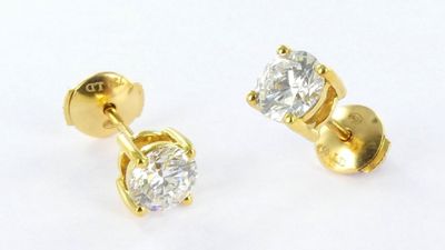 pair of diamond stud earrings on a white background