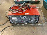a small machine that is sitting on the floor
